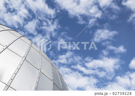 Shiny observatory dome under blue sky, abstract 62739228