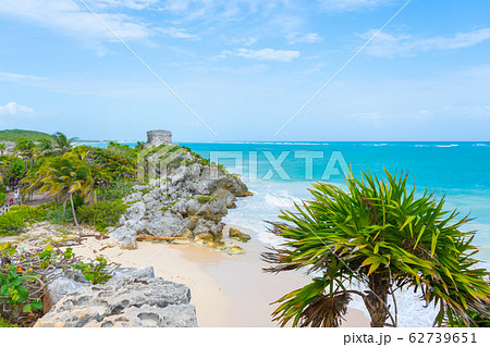 Ruins of ancient Tulum. Architecture of ancient maya. View with sea. Blue sky and lush greenery of nature. travel photo. Wallpaper or background. Yucatan. 62739651
