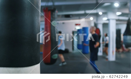 Training gym - punching bag hanging on the side Training gym - punching bag hanging on the side 62742249