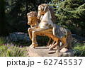 A monument with two golden horses shines from the 62745537