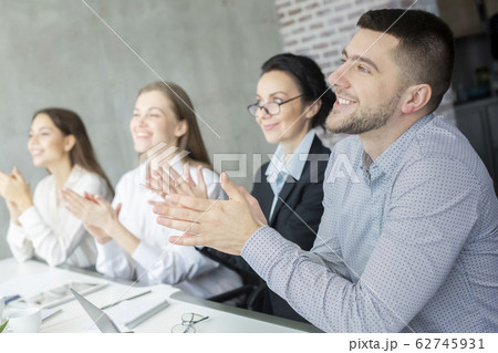 Professional education. Happy business listeners clapping hands Professional education. Happy business listeners clapping hands 62745931