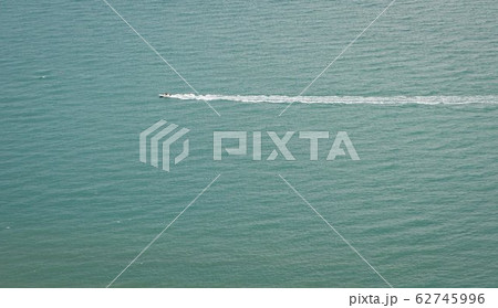 Green fields on a hill with the sea English Green fields on a hill with the sea English 62745996