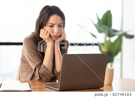European young student using pc at work place European young student using pc at work place 62746163