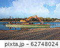 Excavator for channel dredge on a barge. 62748024
