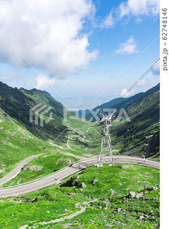 Top vew of winding road in mountains, and power 62748146