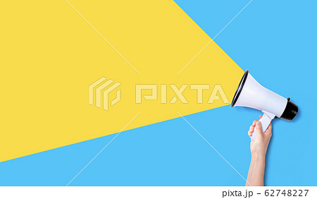 Person holding a megaphone 62748227