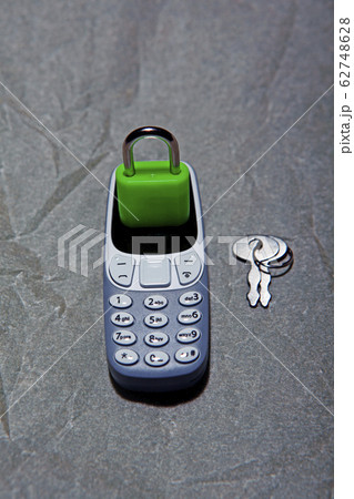 mobile phone lock key parchment paper background 62748628
