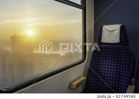 Train interior with chair and sunrise view on 62749560