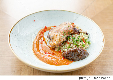 Plate Duck leg su-vide, with bulgur and onion marmalade. Barbecue restaurant menu, a series of photos of different meats 62749877