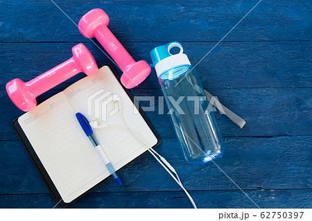 Top view notebook,headphones, water bottles, pink 62750397