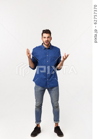 Charming handsome. Handsome young man in casual wear while standing isolated on white background 62757370