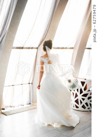 Portrait of a beautiful fashion bride, sweet and sensual. Wedding make up and hair Portrait of a beautiful fashion bride, sweet and sensual. Wedding make up and hair 62759479