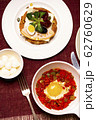A dish of the fried egg with the stewed peppers. Top view. 62760629