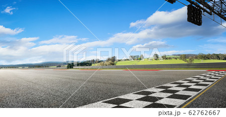 Wide angle view empty asphalt international race track with start and finish line , morning scene . 62762667