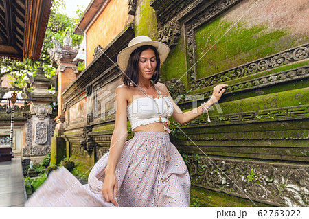 Happy woman near ancient asian building stock photo Happy woman near ancient asian building stock photo 62763022