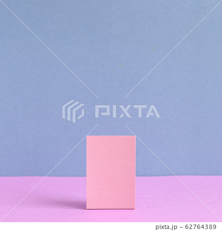 Pink memo paper, sticky notes on pink and purple background 62764389