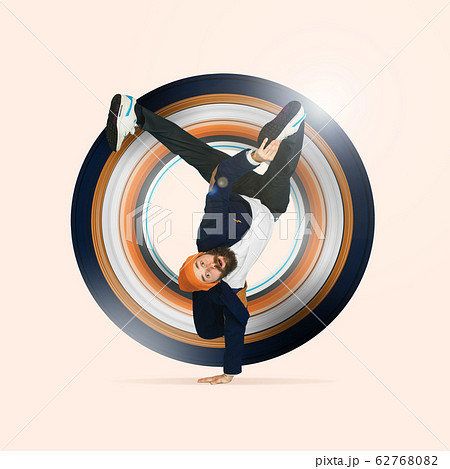 Businessman having fun dancing break dance on blue background at work Businessman having fun dancing break dance on blue background at work 62768082