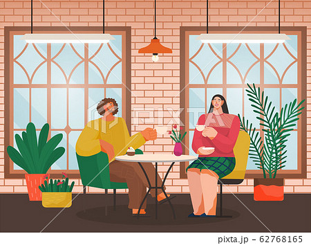 Eating Out, Couple in Cafe Drinks Coffee at Table 62768165