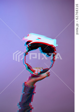 Hand with virtual reality headset. Technology of future. Image with glitch effect. 62768316