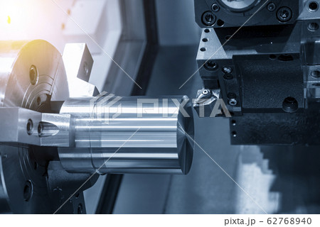 The CNC lathe machine rough cutting the metal part. 62768940