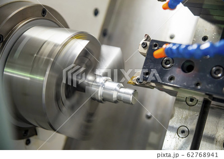 The CNC lathe machine in metal working process. 62768941
