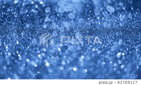 Holiday abstract texture. Christmas card with copy space. Сlassic blue background bokeh, defocused lights. 62769127