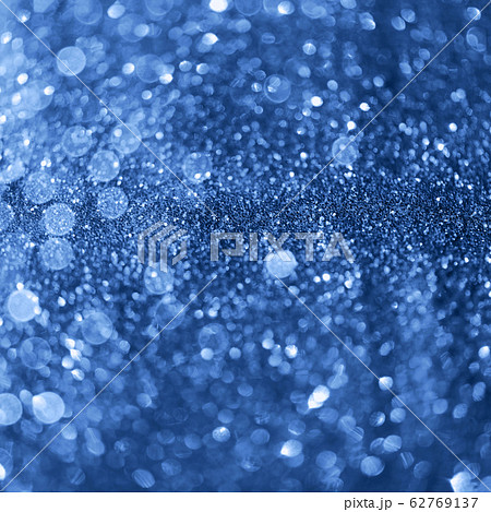Holiday abstract texture. Christmas card with copy space. Сlassic blue background bokeh, defocused lights. 62769137