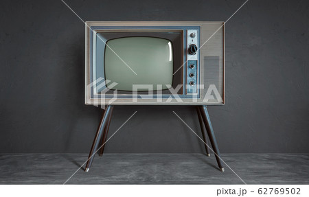 Vintage retro television on a cement wall background . 62769502