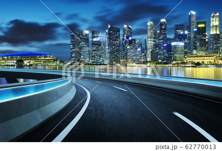 Highway overpass modern Singapore city skyline background . Night scene . 62770013
