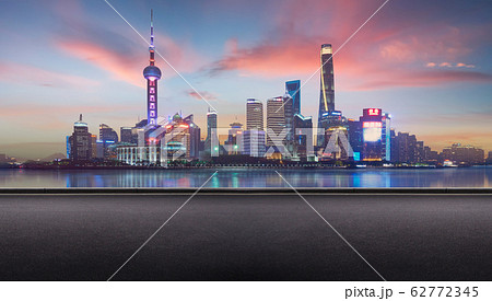 Side view asphalt road on sunrise scene near the modern Shanghai city . 62772345