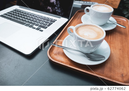 Coffee cup and laptop for business, Selective focus on coffee. 62774062