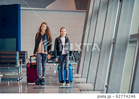 Little kid in airport waiting for boarding Little kid in airport waiting for boarding 62774246