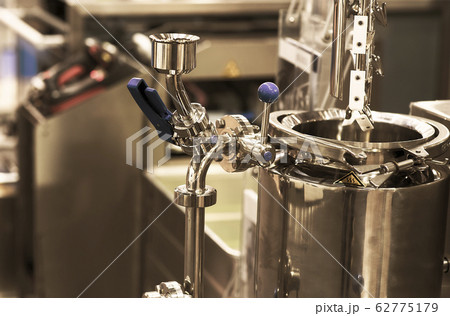 pharmaceutical industry. Production line machine conveyor at factory with bottles pharmaceutical industry. Production line machine conveyor at factory with bottles 62775179