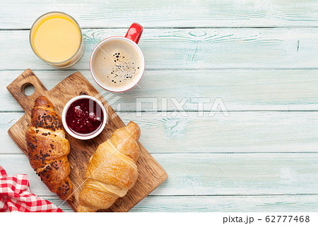 Breakfast with coffee and croissant Breakfast with coffee and croissant 62777468