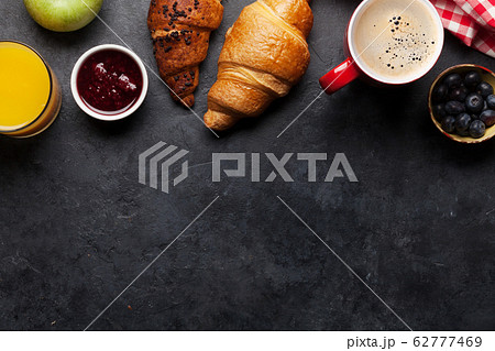 Breakfast with coffee and croissant Breakfast with coffee and croissant 62777469