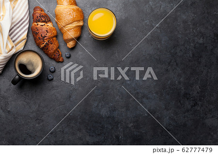 Breakfast with coffee and croissant Breakfast with coffee and croissant 62777479