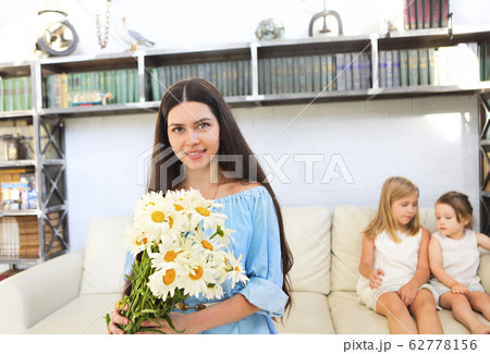 Little girl giving bouquet of beautiful flowers to Little girl giving bouquet of beautiful flowers to 62778156