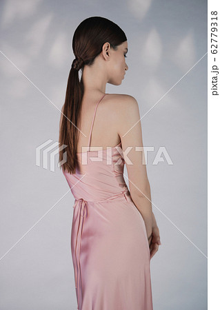 Beautiful woman pose in studio in pink classic 62779318