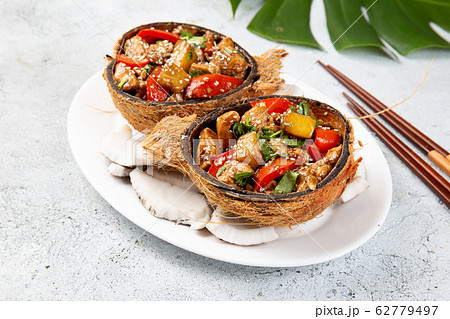 Hawaiian pinapple chicken in natural coconut shell 62779497