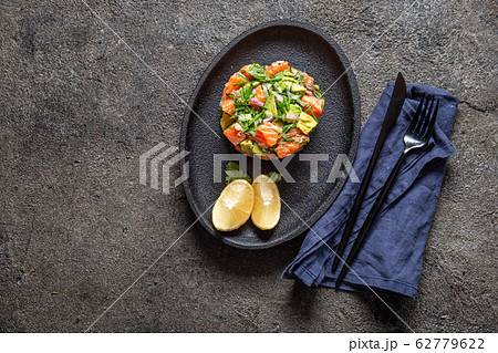 PERUVIAN NIKKEI FOOD. Salmon avocado ceviche on 62779622