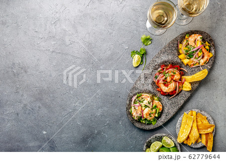 CEVICHE. Three colorful shrimps ceviche with 62779644