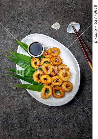 Fried squid rings on white plate decorated with 62779659