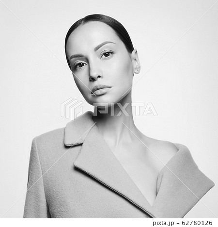 Fashion beautiful lady in beige coat Fashion beautiful lady in beige coat 62780126