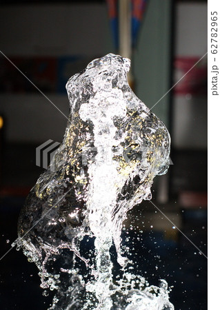 Water splash from curtain in the air over black 62782965