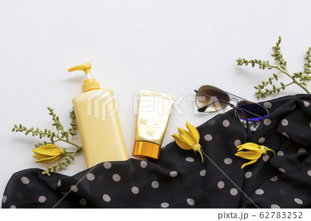sunscreen spf50  cosmetics health care for skin face with body lotion, sunglasses, black scarf of lifestyle  62783252