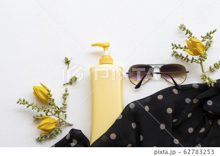 sunscreen body lotion health care for body skin with sunglasses, black scarf and yellow flower ylang ylang sunscreen body lotion health care for body skin with sunglasses, black scarf and yellow flower ylang ylang 62783253
