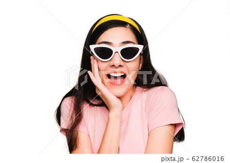 Young beautiful asian woman,long black hair Wearing a pink t-shirt, White fashion glasses, Yellow hair band smiling and Surprised isolated on white background 62786016