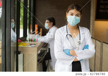 woman doctor with stethoscope standing and looking to camera in the hospital. woman doctor with stethoscope standing and looking to camera in the hospital. 62786780
