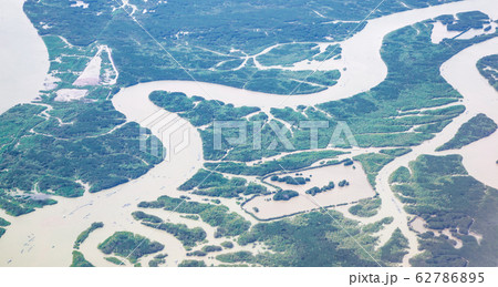 Bird eye view from plane window: Ho Chi Minh City with meandering Saigon River at dusk on rainy day 62786895