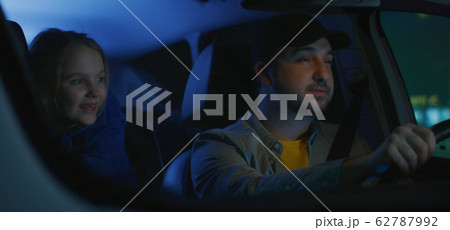 Man driving unsafely with daughter Man driving unsafely with daughter 62787992